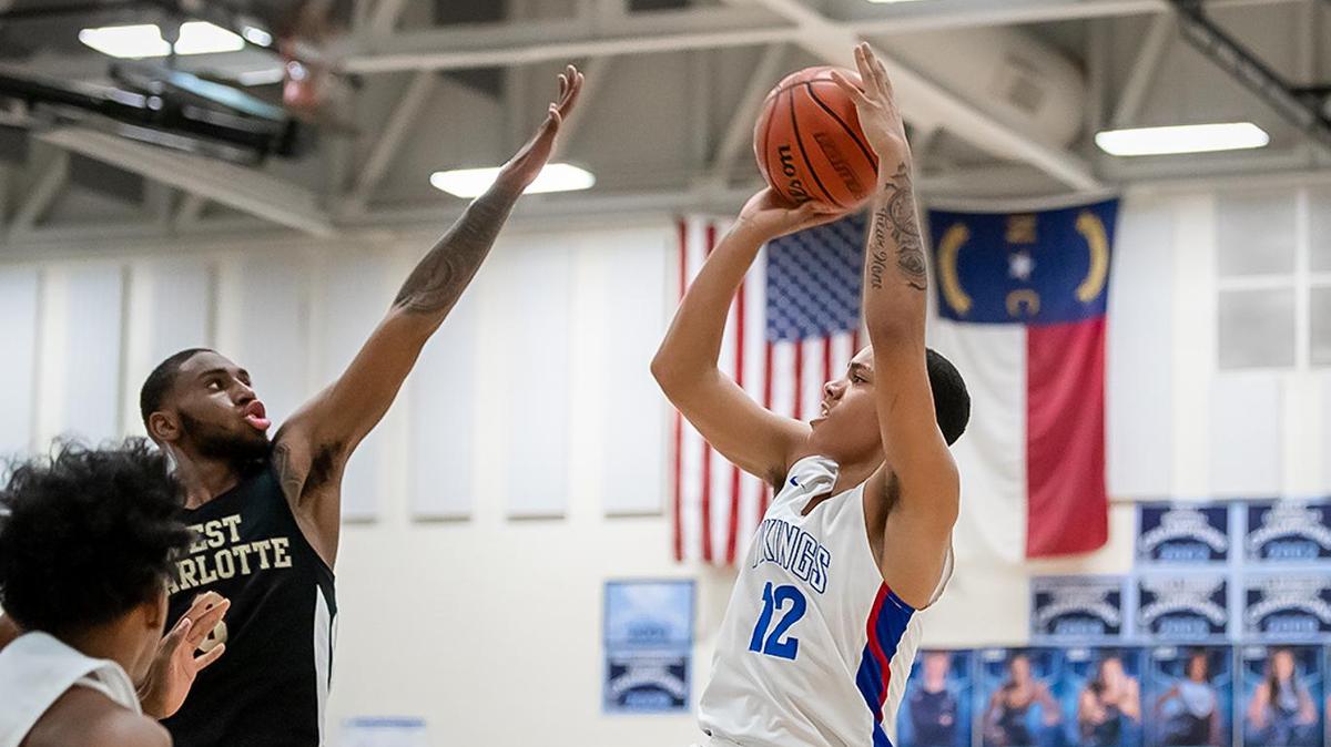 North Meck’s Triston Maxwell (12) pulls up outside the lane for the 2-point basket.