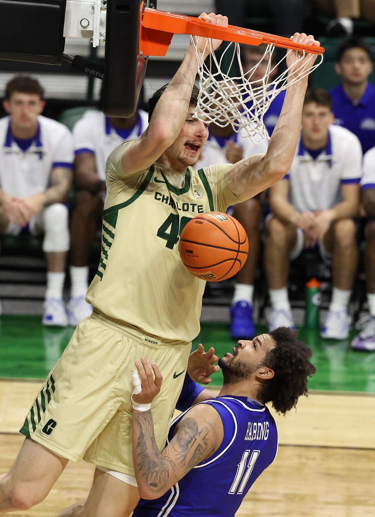 Charlotte 49ers center Anton Bonke throws down a two-handed dunk over Indiana State center Markus Harding in the opening moments of game action on Monday, Nove at Halton Arena.