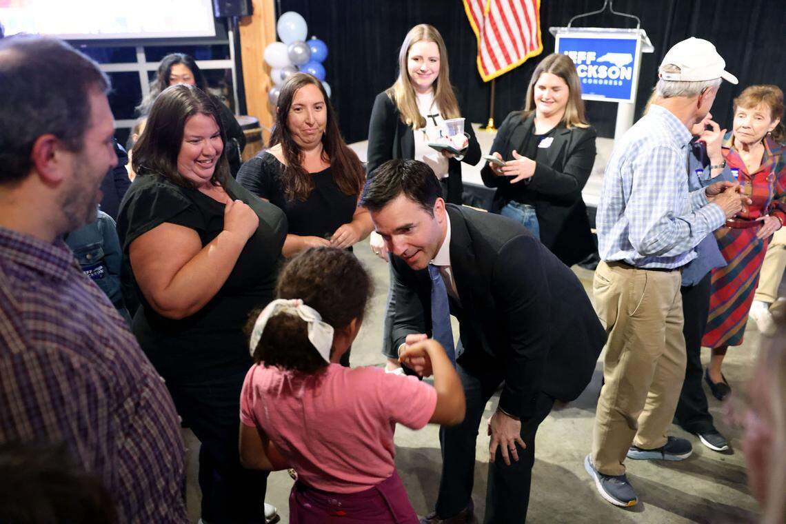 State Sen. Jeff Jackson greets Ruthie Murray, 8, after he made his acceptance speech at Lenny Boy Brewing Co. in Charlotte on Tuesday, Nov. 8, 2022. ‘We have won.’ Jackson declares victory in 14th Congressional District