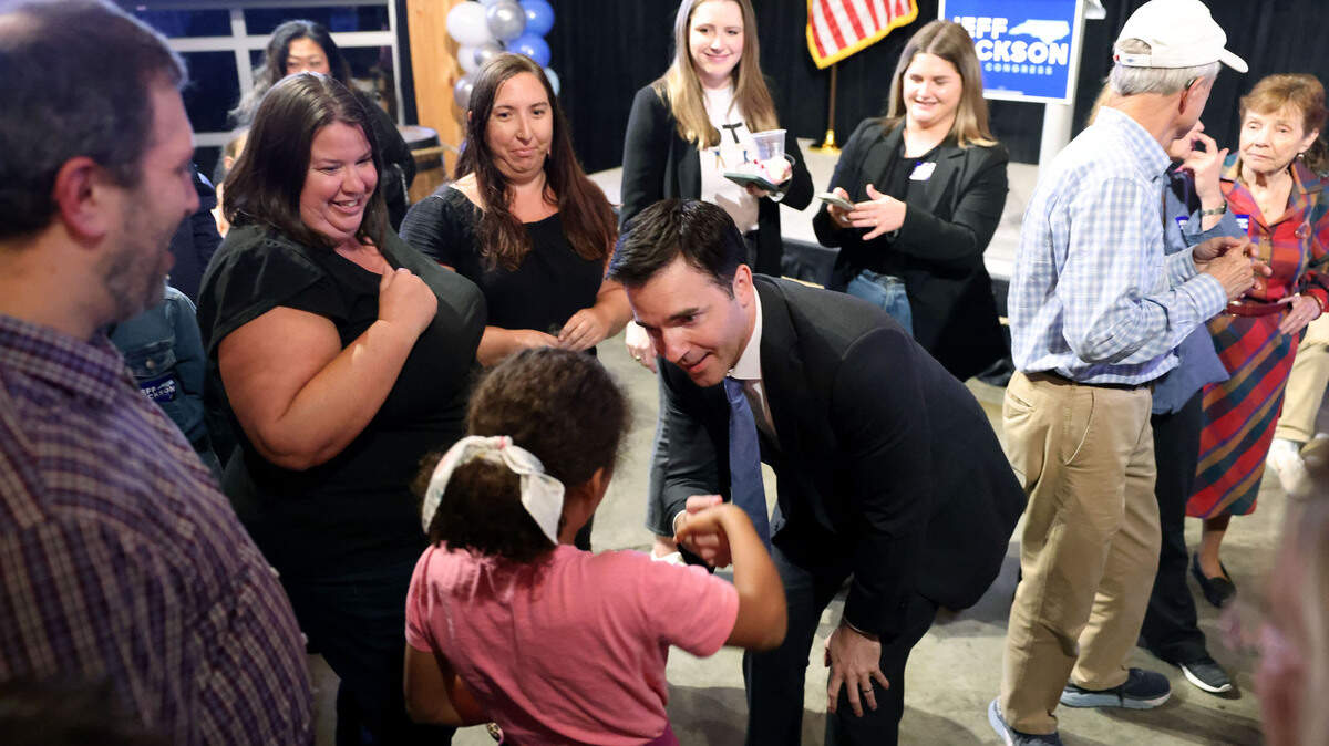 State Sen. Jeff Jackson greets Ruthie Murray, 8, after he made his acceptance speech at Lenny Boy Brewing Co. in Charlotte on Tuesday, Nov. 8, 2022. ‘We have won.’ Jackson declares victory in 14th Congressional District