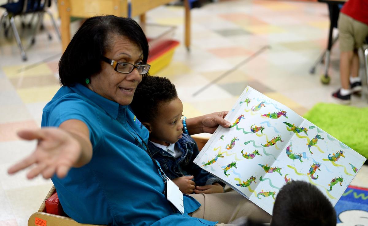 Teacher Charlotte Goodman reads a book about seahorses to Tanner Williams in a pre-K class at Smart Kids No. 1 in Charlotte. New classes funded by Mecklenburg County will join the NC Pre-K classes on Sept. 26.