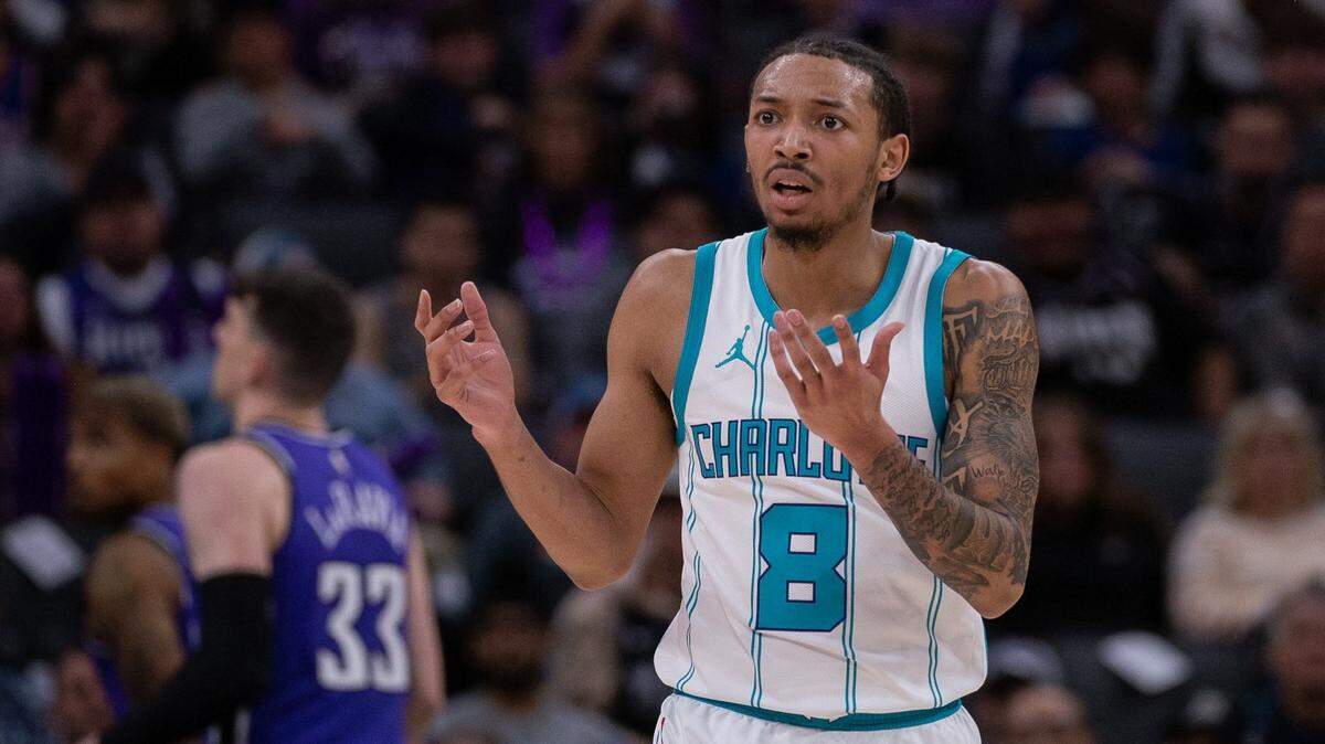 Charlotte Hornets guard Nick Smith Jr. (8) argues a call during the second quarter against the Sacramento Kings at Golden 1 Center.