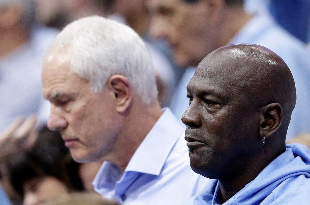 Charlotte Hornets general manager Mitch Kupchak, left, said in April the team would do everything they can to re-sign Kemba Walker. But that apparently that doesn’t include risking the NBA’s luxury tax, which owner Michael Jordan also wants to avoid.