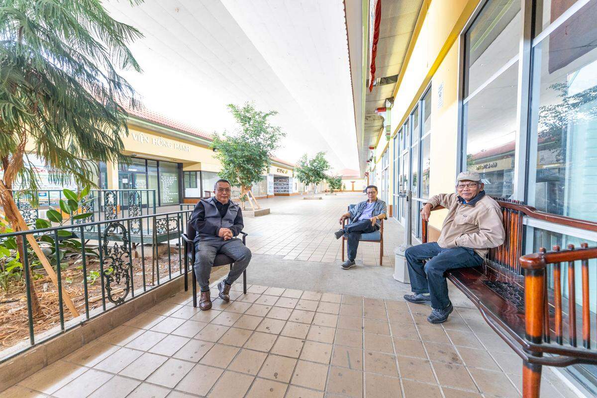Duong Ngo, Minh Quang Nguyen and Thy Thach relax inside the Asian Corner Mall.