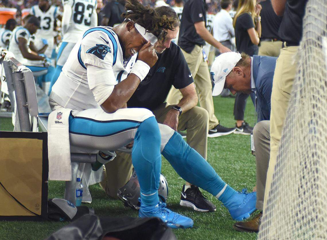 Carolina Panthers quarterback Cam Newton grimaces in pain after injuring his left foot during first half action against the New England Patriots at Gillette Stadium in Foxborough, Mass. on Thursday, August 22, 2019.