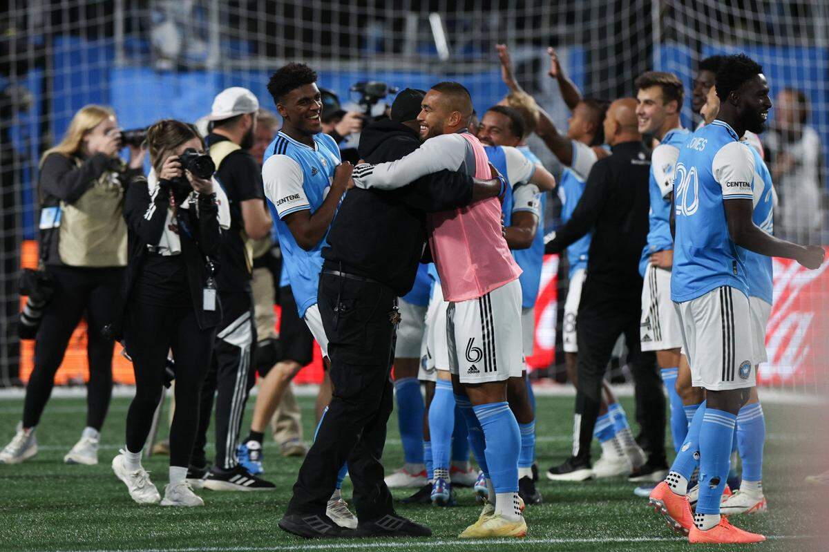Charlotte FC teammates and coaches celebrate after their 1-0 win over Inter Miami at Bank of America Stadium on Saturday, October 21, 2023 in Charlotte, NC. With the win, Charlotte FC clinches a spot in the playoffs.