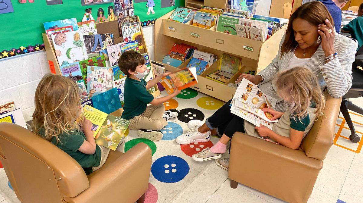 Pre-K students read at Charles Drew Charter School.