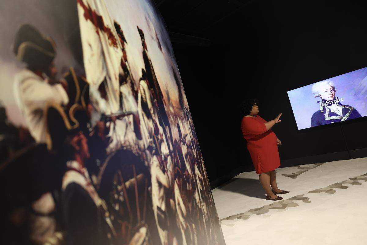 Terri White, president and CEO of the Charlotte Museum of History, talks about the “American Revolution: The Augmented Exhibition” on Tuesday, April 7, 2026. The year-long exhibit opens April 14.
