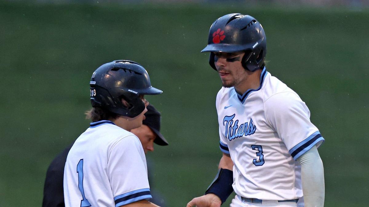 Hopewell’s Tyler Howe, right, leaps into the air as he crosses home plate and is congratulated by teammate Brayden DeWolfe, left, during prep action against Hough on Friday, April 26, 2024 at Hopewell High School.