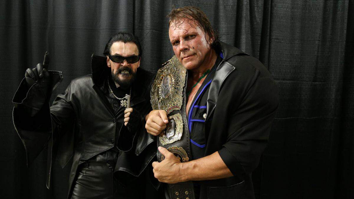 PCO, at right, with his manager and trainer Destro after PCO won Ring of Honor’s World Championship.