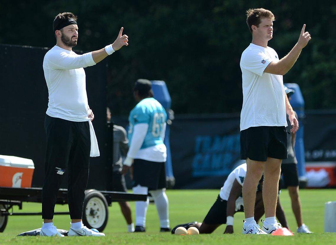Carolina Panthers quarterbacks Baker Mayfield (left) and Sam Darnold run through a drill in July 2022. Although Darnold had a six-month head start on Mayfield in offensive coordinator Ben McAdoo’s system, Mayfield won the starting job in training camp.
