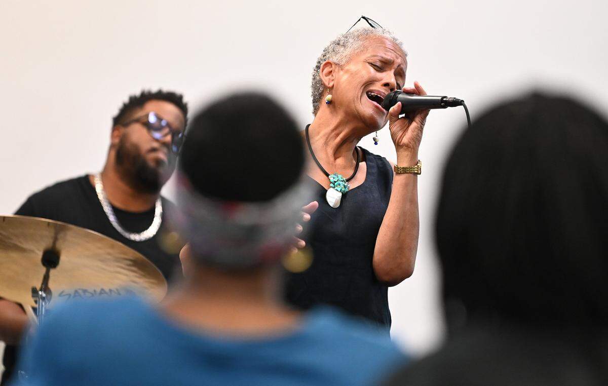 Toni Tupponce and the band A Sign of the Times perform at the West Boulevard Library in Charlotte on Friday, June 7, 2024. Tupponce is the lead vocalist and program director while her husband Tyrone Jefferson is the trombonist. The couple lead the band as well as a music organization dedicated to improving the community through cultural productions and educational programs that positively reflect the heritage of African Americans.