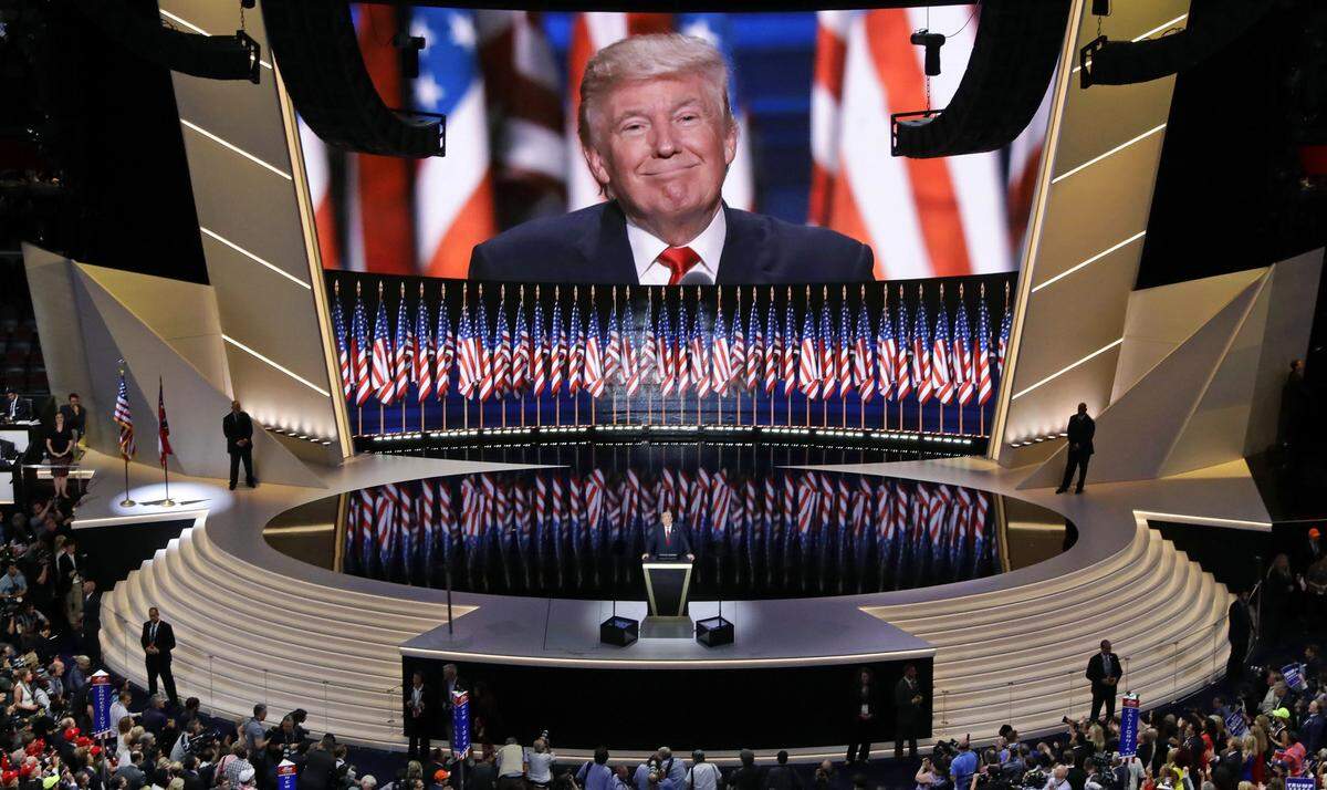 In this July 21, 2016, photo, Republican presidential candidate Donald Trump addresses delegates during the final day session of the Republican national convention in Cleveland. A small group of Charlotte officials are planning to attend the RNC's summer meeting in Austin, Texas, in July, where they expect the RNC will name the winning city for the 2020 convention.