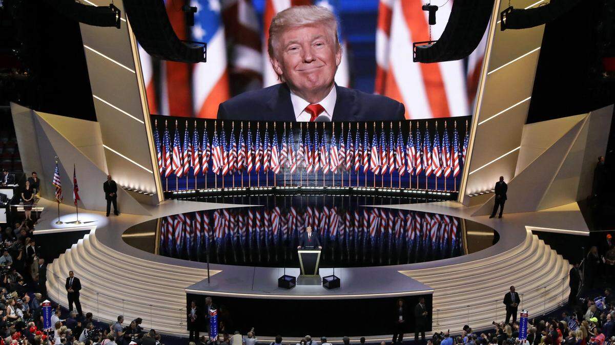 In this July 21, 2016, photo, Republican presidential candidate Donald Trump addresses delegates during the final day session of the Republican national convention in Cleveland. A small group of Charlotte officials are planning to attend the RNC's summer meeting in Austin, Texas, in July, where they expect the RNC will name the winning city for the 2020 convention.