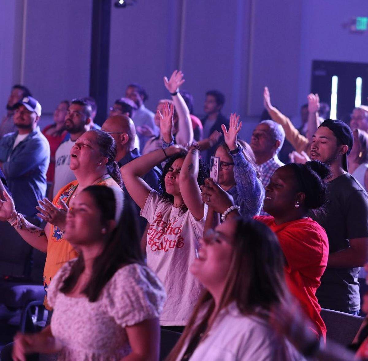 Church-goers worship at Casa De Avivamiento. The Bilingual church is working to establish a permanent home in Mint Hill.