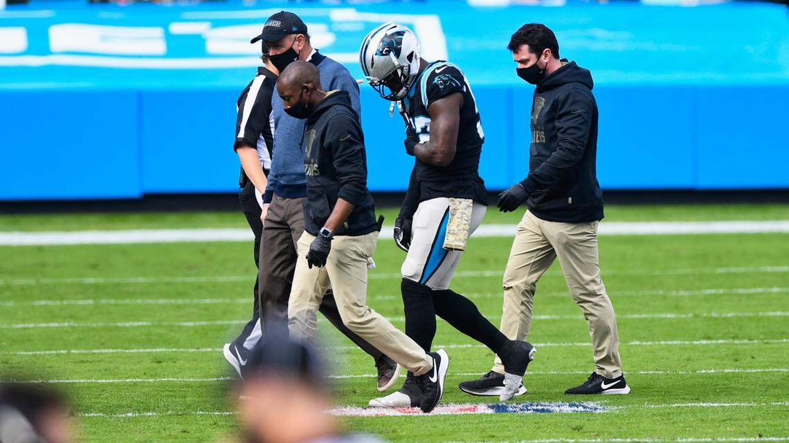 Panthers LB Tahir Whitehead walks off the field after being injured during the Buccaneers first play offensive play at Bank of America Stadium in Charlotte, NC on Sunday, November 15, 2020.