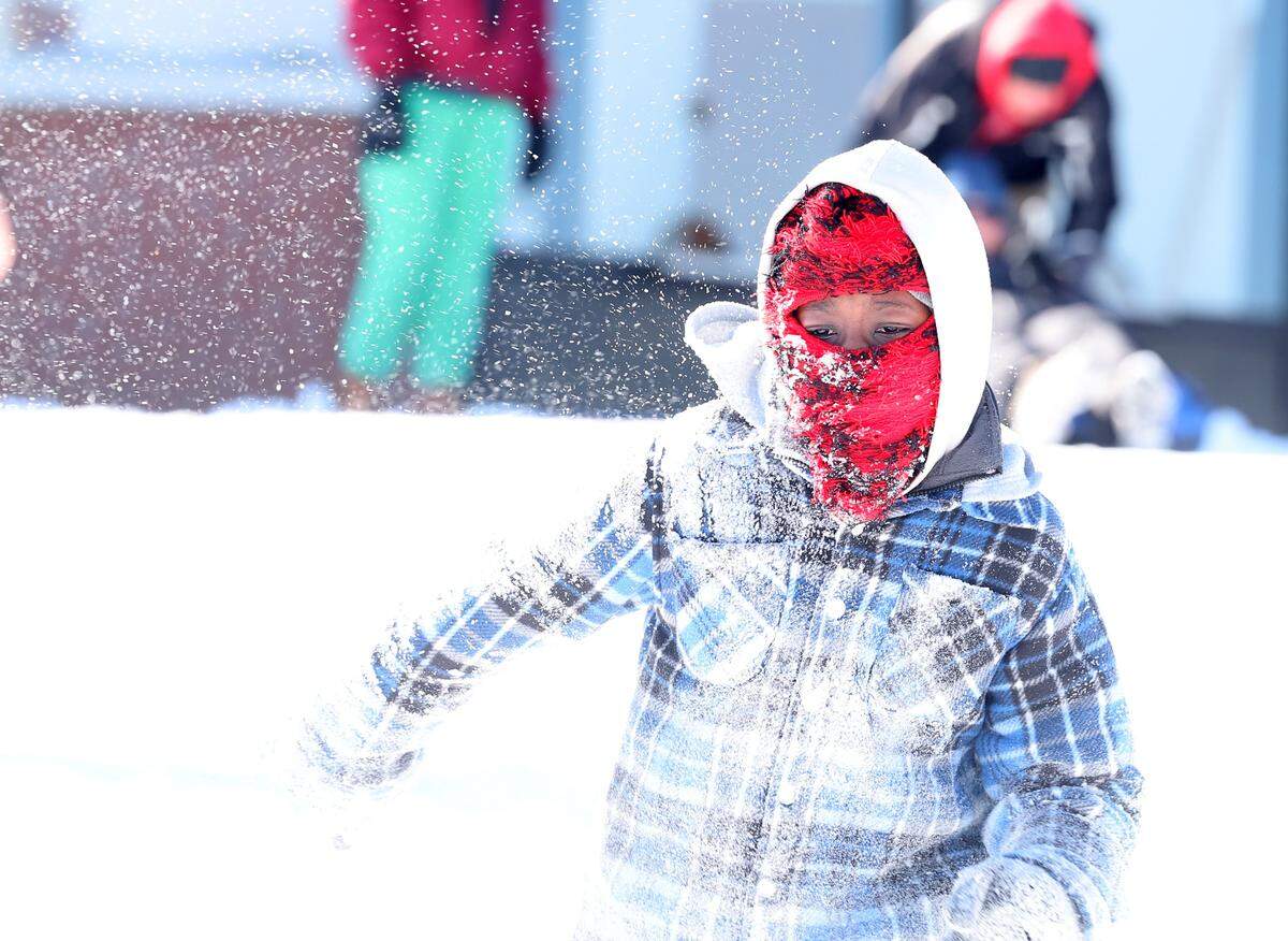 Azilynn Keitt runs in the snow Sunday, Feb. 1, 2026 in Rock Hill, S.C.