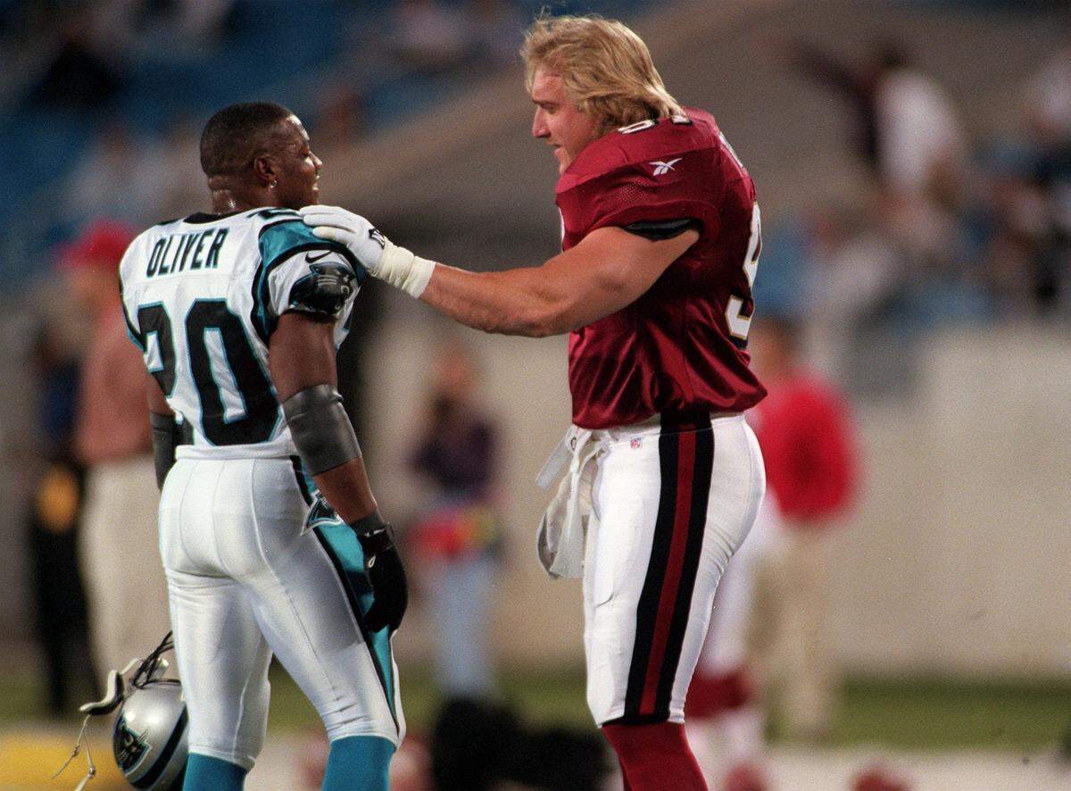 Panthers running back Winslow Oliver (left) used to have to go against Kevin Greene (right, while playing for San Francisco) in Carolina practices in full-speed blocking drills.