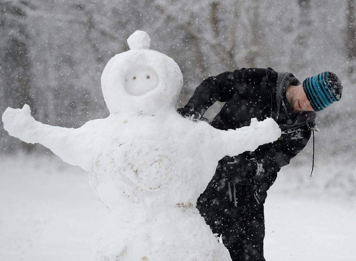 Aaron Pearce of Charlotte, NC finally got the sticky snow that he has been waiting for to build a snowman on Wednesday, January 17, 2018.