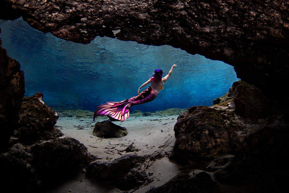 For mermaid performers, a tail is not a one-time purchase, Morgana Alba said. Here she is swimming in a Finfolk tail, one of many tails she owns.