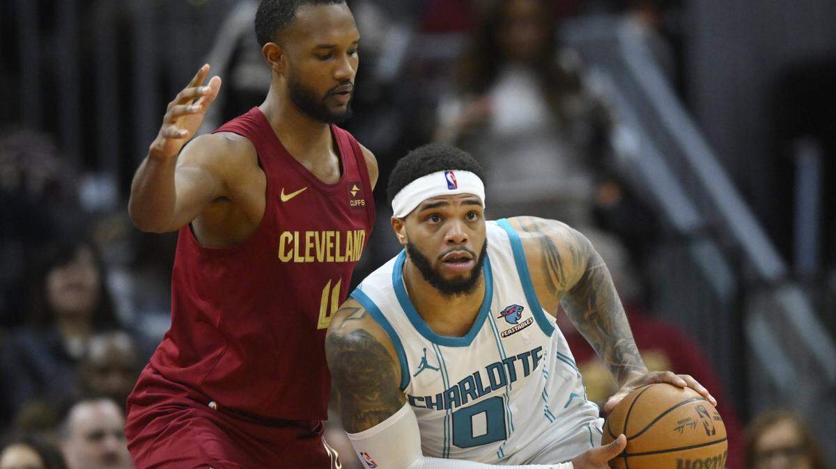 Cleveland Cavaliers forward Evan Mobley (4) defends Charlotte Hornets forward Miles Bridges (0) in the second quarter at Rocket Mortgage FieldHouse.