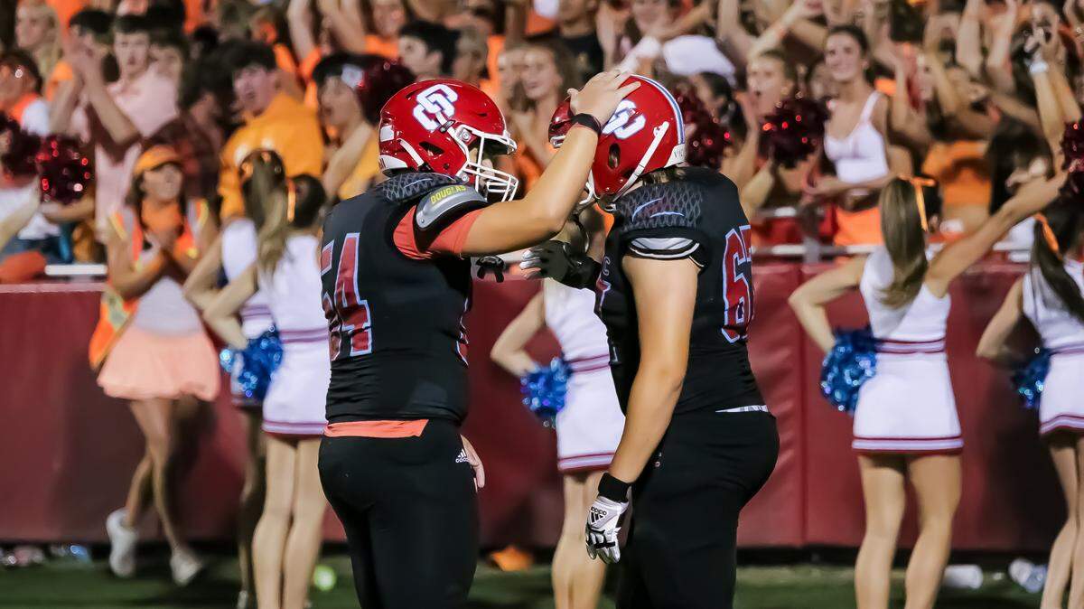 Charlotte Catholic players celebrate a season-opening victory over South Meck in Charlotte, NC, on Friday, Aug. 23, 2024.