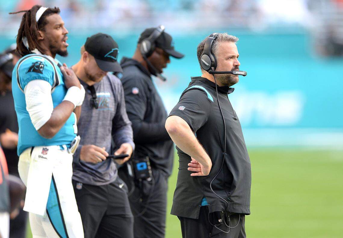 Carolina Panthers head coach Matt Rhule, right, stands along the team’s sideline during fourth quarter action against the Miami Dolphins at Hard Rock Stadium in Miami Gardens, Fla. on Sunday, November 28, 2021. The Dolphins defeated the Panthers 33-10.