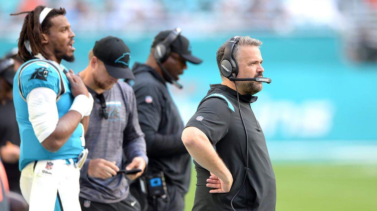 Carolina Panthers head coach Matt Rhule, right, stands along the team’s sideline during fourth quarter action against the Miami Dolphins at Hard Rock Stadium in Miami Gardens, Fla. on Sunday, November 28, 2021. The Dolphins defeated the Panthers 33-10.
