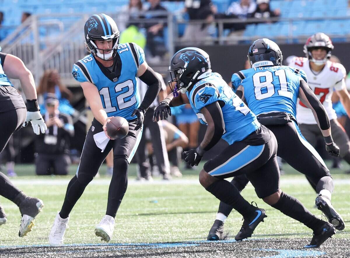 Carolina Panthers quarterback Kenny Pickett hands the ball to running back Trevor Etienne Sunday, Oct. 25, 2026 at Bank of America Stadium in Charlotte.