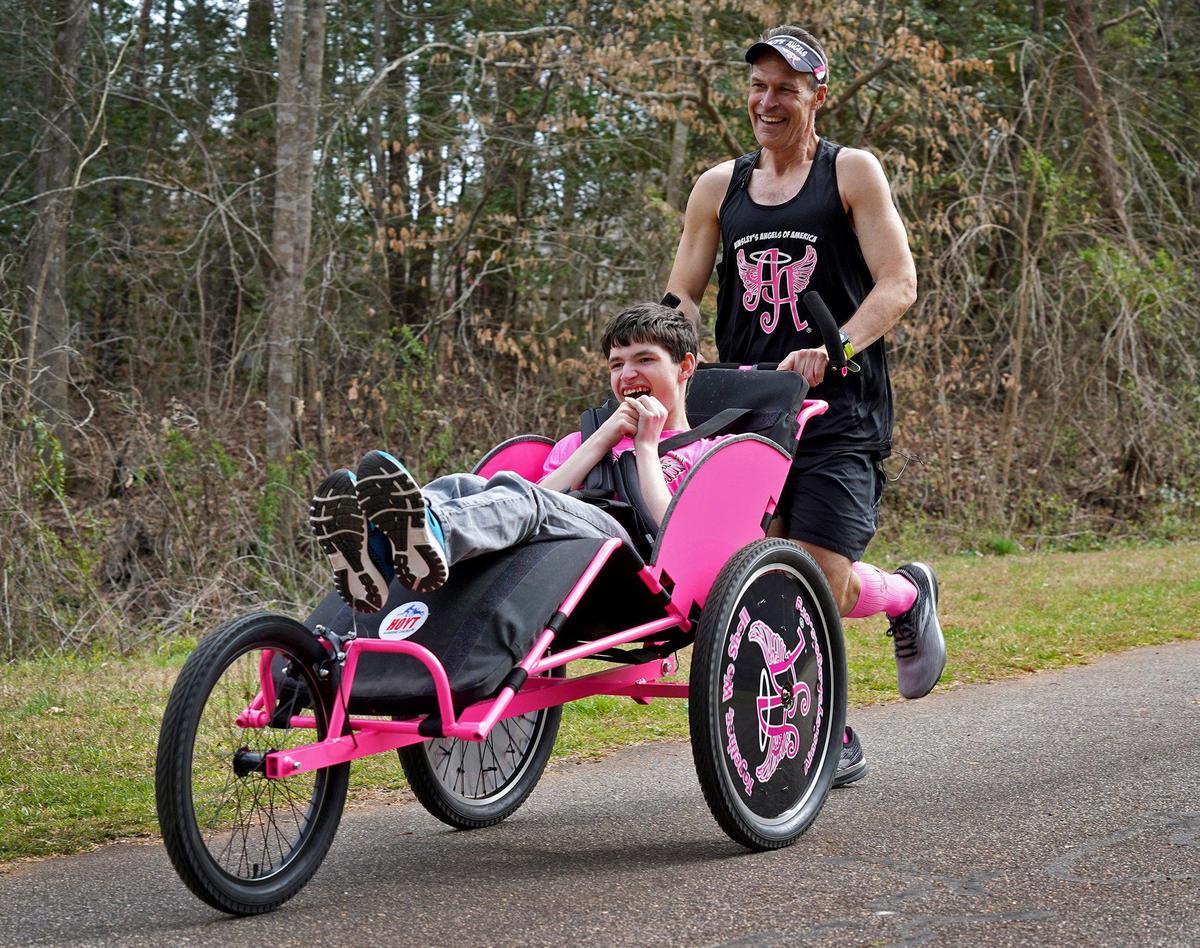 “If what we’re doing can inspire one person to try to do something that they normally couldn’t do, then we’ve done more than we ever thought possible,” says Bill Johncock, photographed in Hickory with his son Logan.