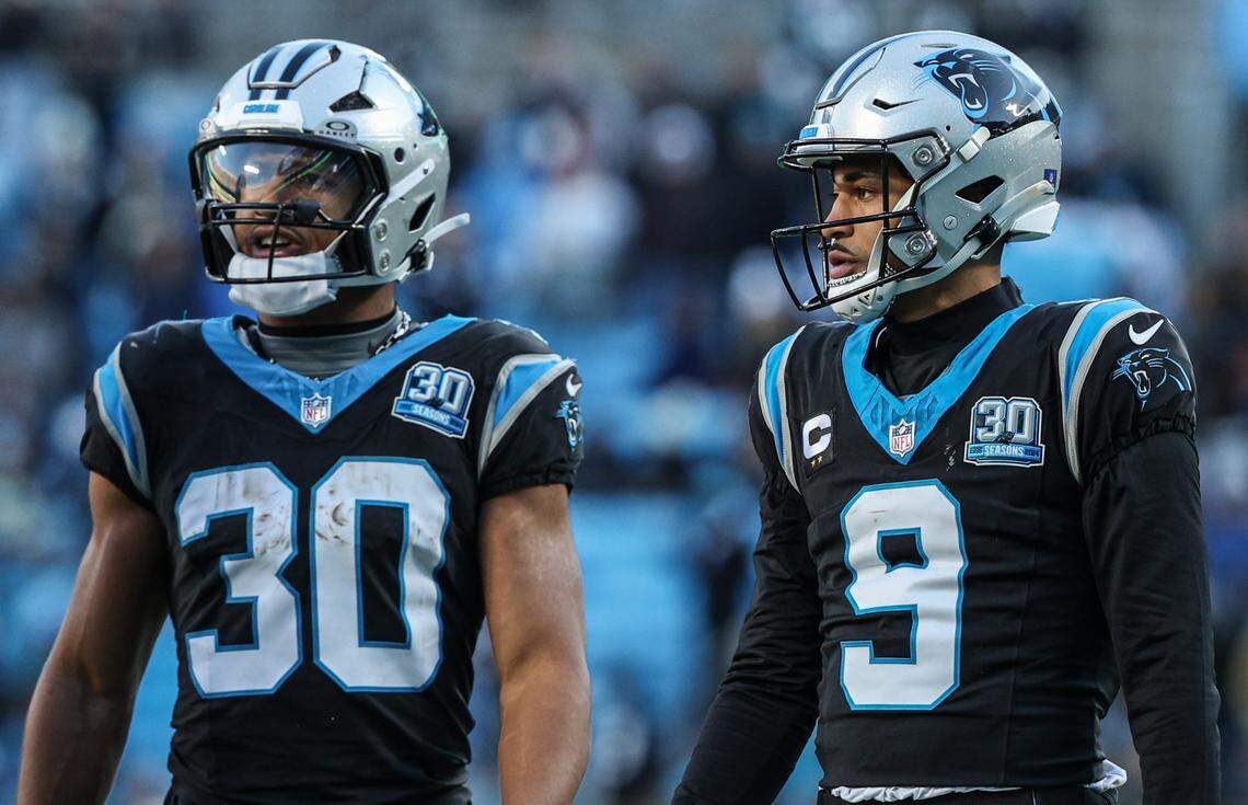Panthers runningback Chuba Hubbard, left, and quarterback Bryce Young, during the game at Bank of America Stadium in Charlotte, NC on Sunday, December 22, 2024.