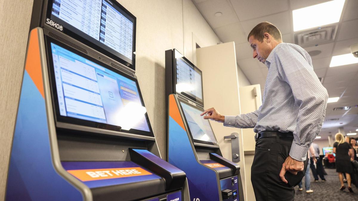 Todd San Jule, general manager of casino consultant Delaware North demonstrates how to use the betting machines in the sportsbook room at Catawba Two Kings Casino in King’s Mountain, N.C., on Wednesday, September 7, 2022.