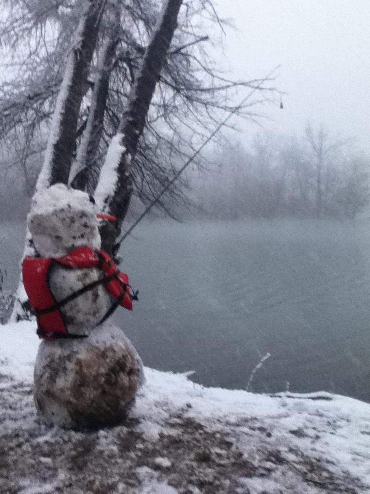 A frosty snowman overlooks the lake in Mount Holly, NC, in 2022.
