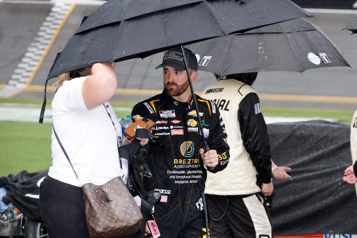 Austin Dillon walks away from his car on pit road after a thunderstorm caused a red flag stoppage during a NASCAR Cup Series auto race at Daytona International Speedway, Sunday, Aug. 28, 2022, in Daytona Beach, Fla. (AP Photo/Terry Renna)
