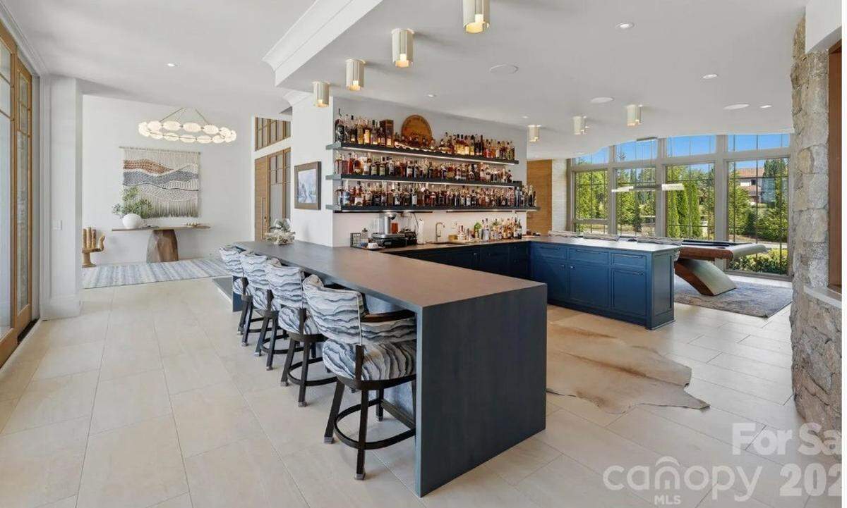The main level of the home includes a chef’s kitchen that connects to outdoor living areas.