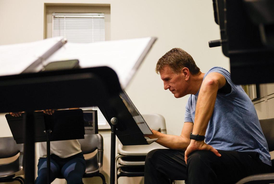 Patrick Ratchford looks over music beyween songs during a Charlotte Squawks rehearsal at CPCC. Their new show runs from June 5-28 at Booth Playhouse.