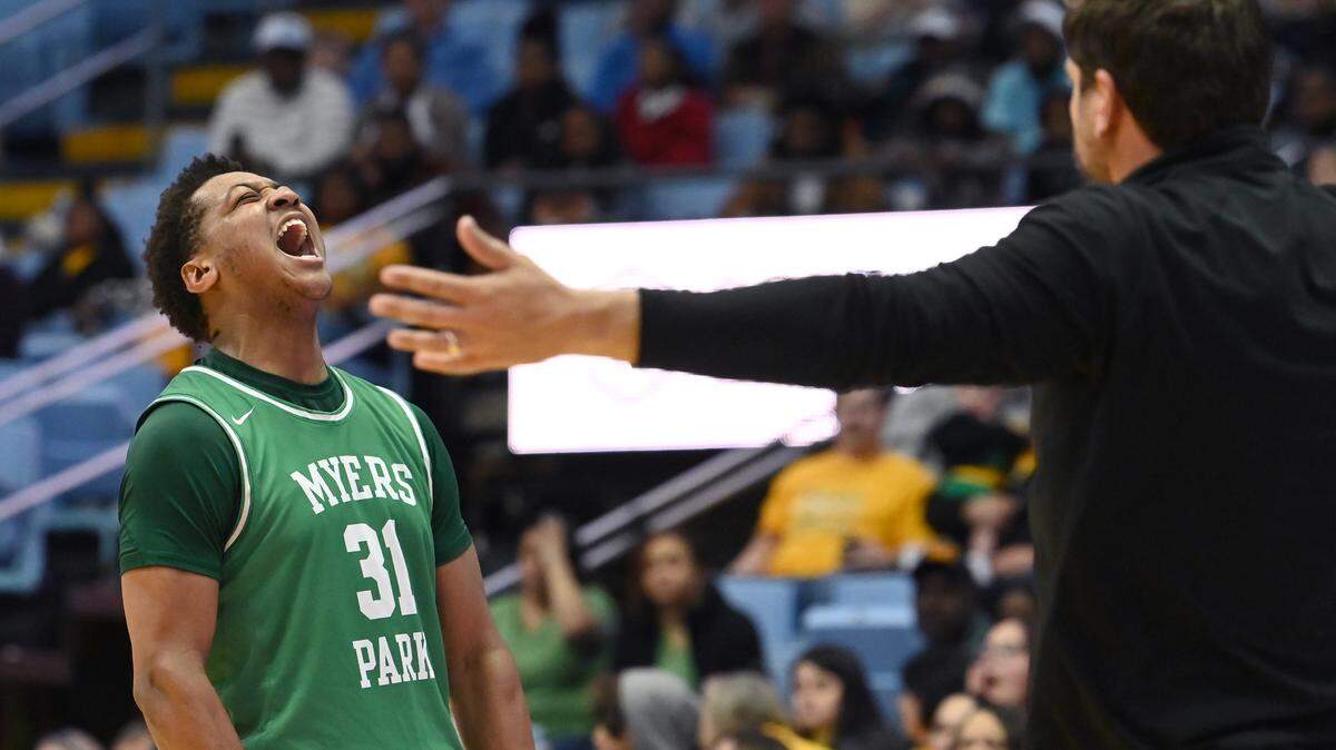Myers Park’s Elijah Strong screams as he heads to the arms of head coach Scott Taylor in celebration of the team’s win over Richmond Senior in the NCHSAA 4A championship game at the Dean Smith Center on Saturday, March 11, 2023. Myers Park defeated Richmond Senior 74-60.
