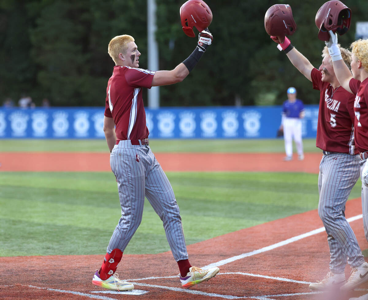 Metrolina Christian’s Jacob Seamon, left, is congratulated by teammates Chase Kiker, center/right and Jett Gibbs, right, after hitting a home run during Game 1 of the NCISAA state final against Charlotte Christian on Friday, May 15, 2026.