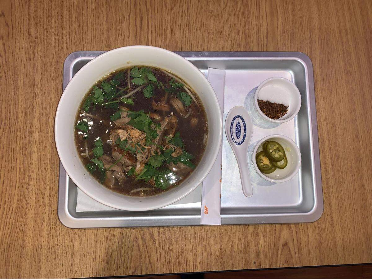 Tender maple roasted duck is the center of the duck noodle bowl.