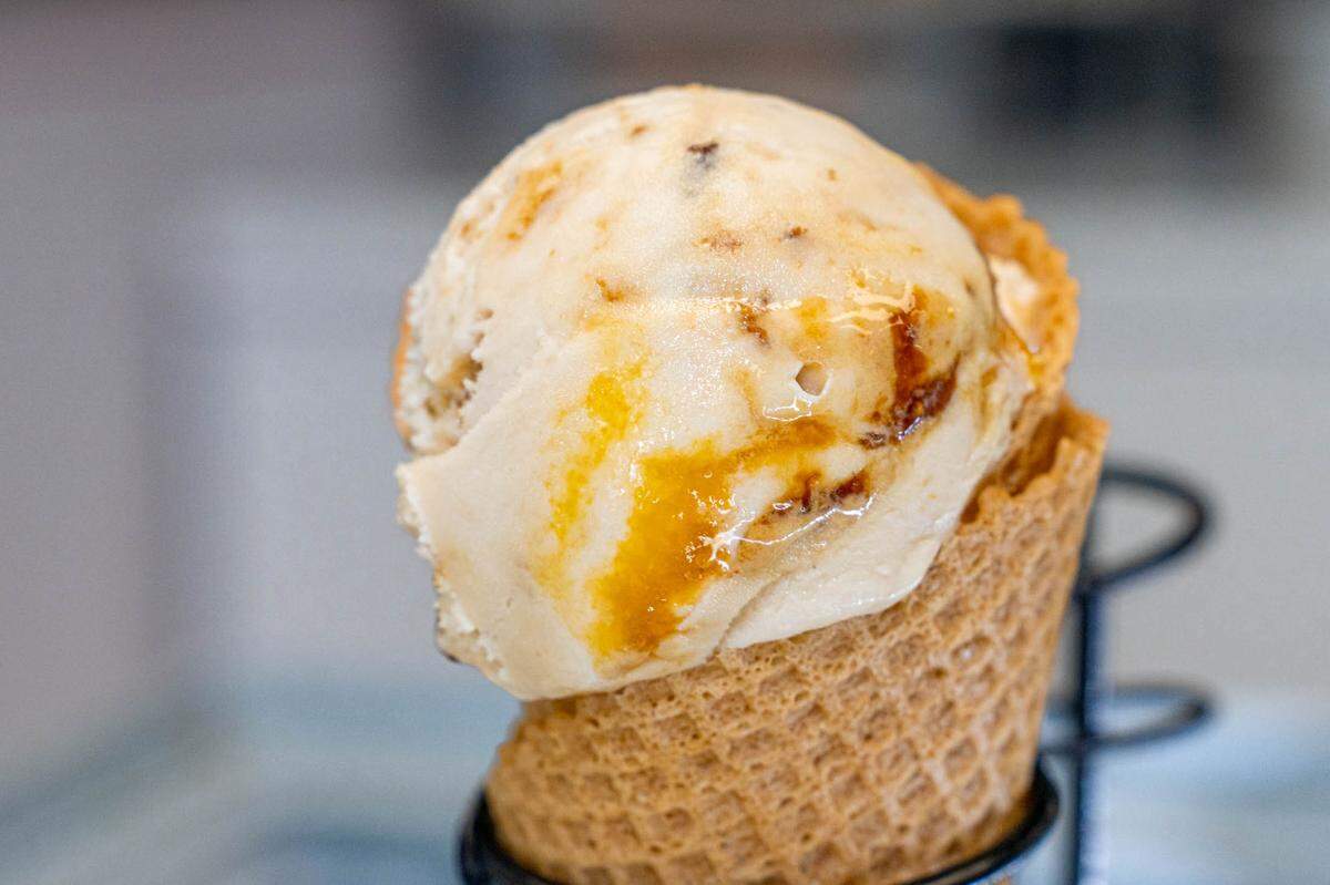 Orange and fig gelato in a homemade waffle cone at Artisen