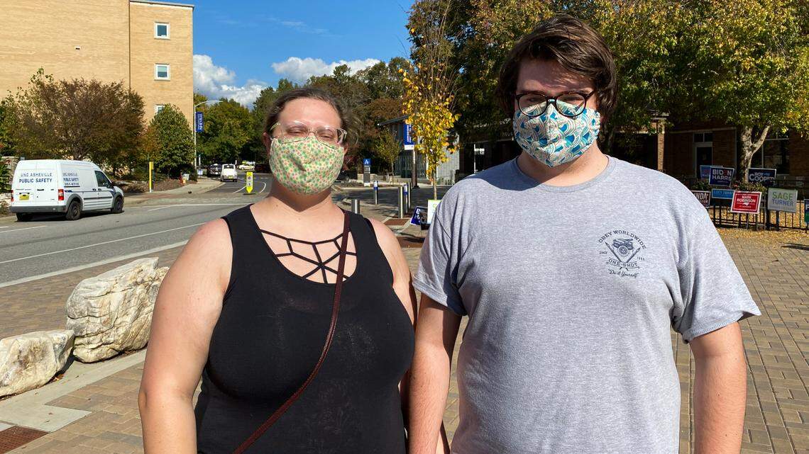 Wyatt Mrozkowski, 18, (right) and Anna Robinson (left), 19, are students at UNC Asheville. Mrozkowski said he voted for Davis because he feels the 11th District is a race between “good and evil.”