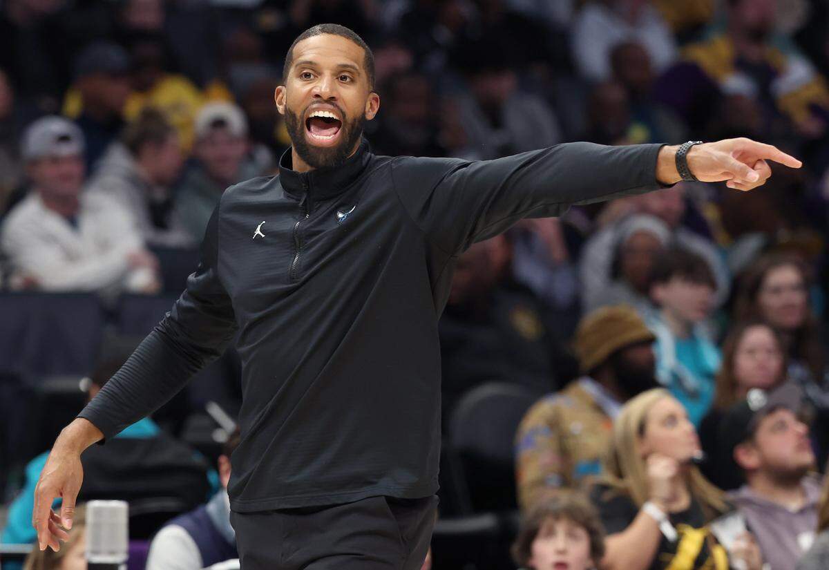 Charlotte Hornets head coach Charles Lee raises a question about a no-call during action against the Los Angeles Lakers at Spectrum Center in Charlotte on Jan. 27, 2025. 