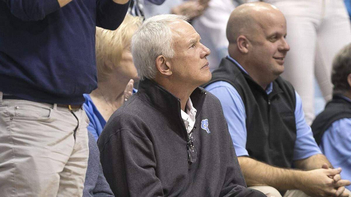 Out of the NBA since a shakeup in the Lakers front office, former Tar Heel Mitch Kupchak (center) wasn't far from basketball. In January, he attended a North Carolina vs. Boston College game at the Smith Center in Chapel Hill.