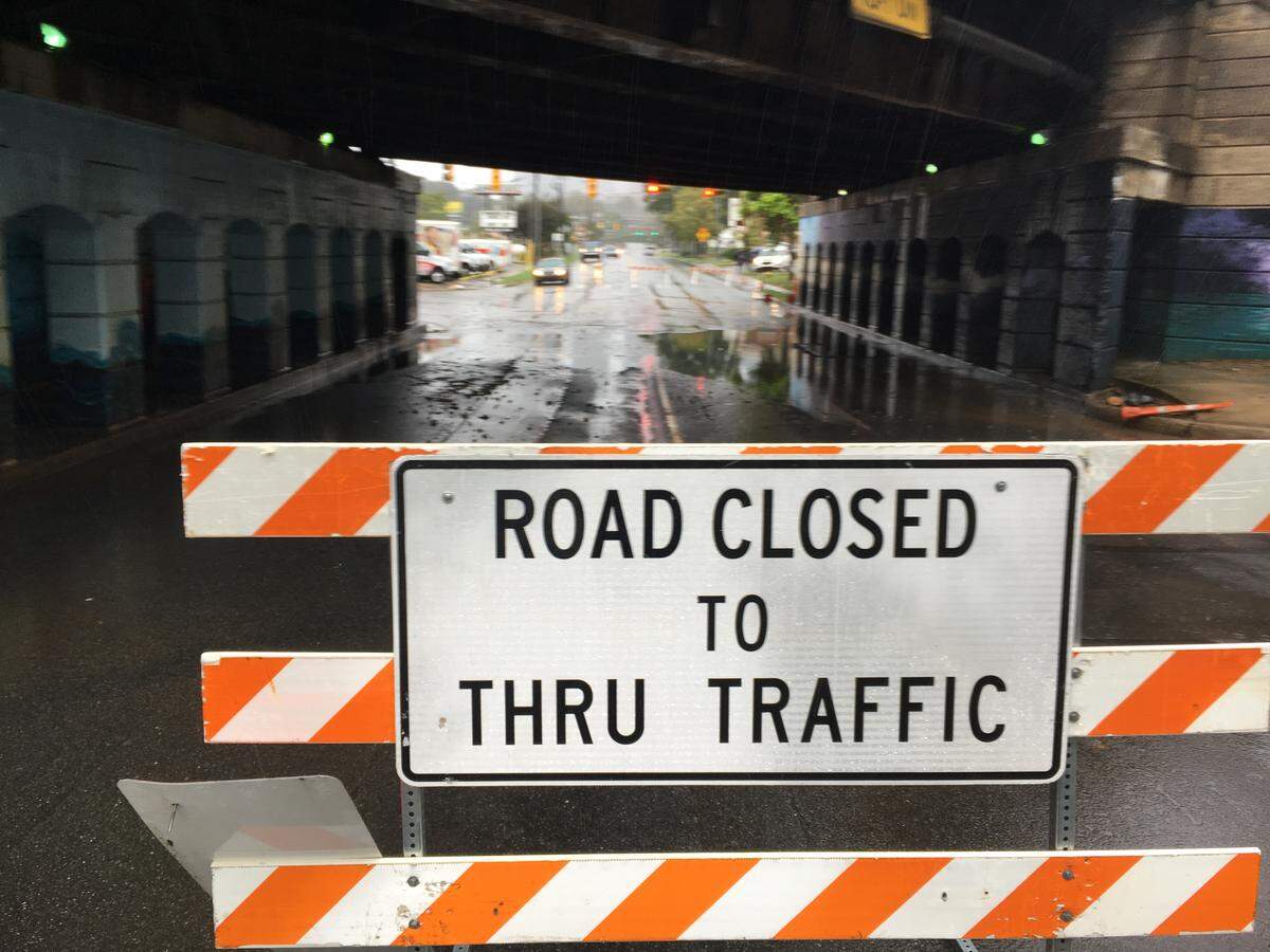 A downed tree closed North Tryon Street at 16th Street in Charlotte on Thursday.