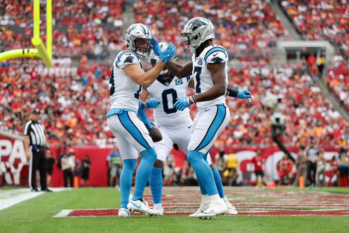 Carolina Panthers wide receiver Adam Thielen (19) celebrates with wide receiver Xavier Legette (17) after scoring a touchdown against the Tampa Bay Buccaneers during a 2024 game at Raymond James Stadium.