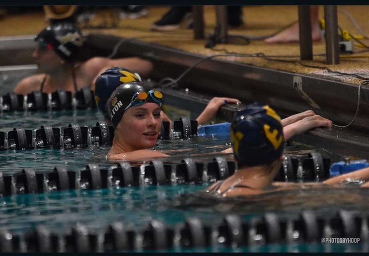 Providence High School swimmer Joslyn Bolton, center, competes in a recent meet.