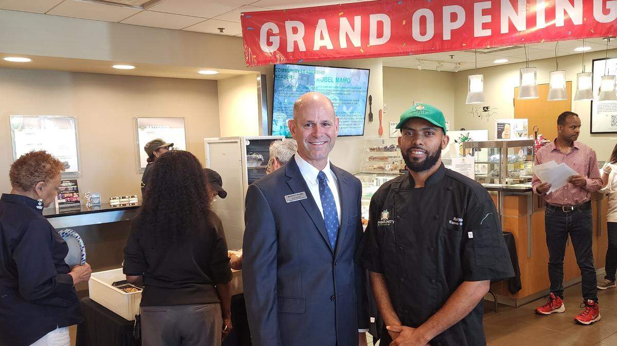 Rod Goodall, director of community engagement at Scott Clark Toyota, and Community Leadership Academy executive director Robel Mamo have teamed up to open Community Kitchen Café locations at two Scott Clark dealerships.