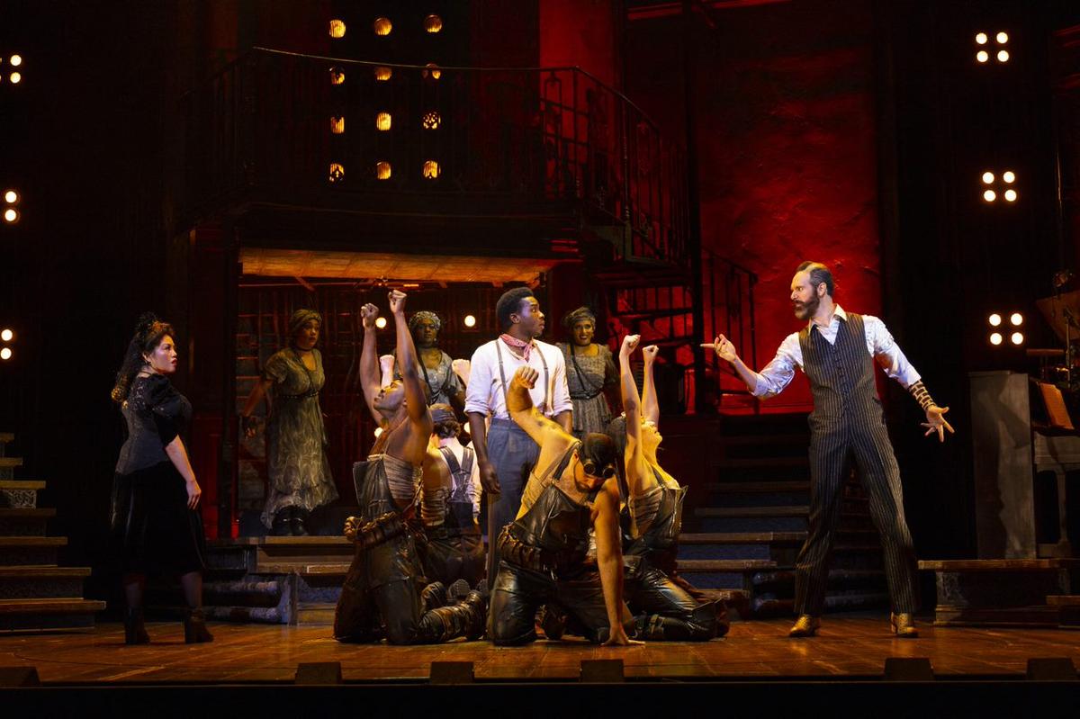Hades (Matthew Patrick Quinn) makes a point in the North American tour of “Hadestown.”