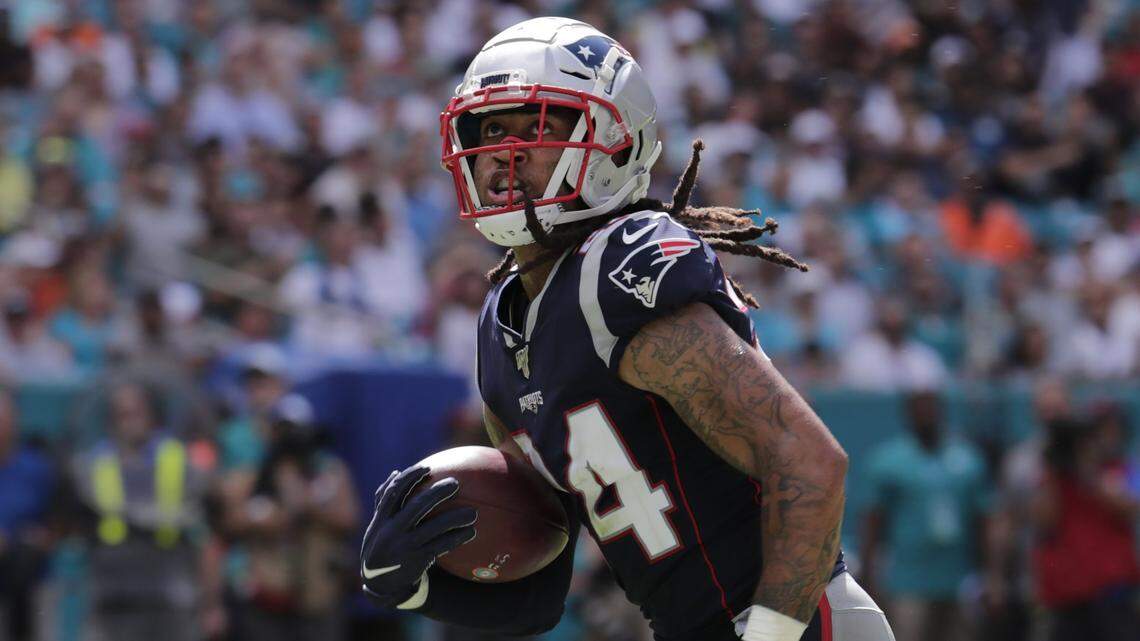 New England Patriots cornerback Stephon Gilmore (24) runs for a touchdown, during the second half at an NFL football game against the Miami Dolphins, Sunday, Sept. 15, 2019, in Miami Gardens, Fla. (AP Photo/Lynne Sladky)