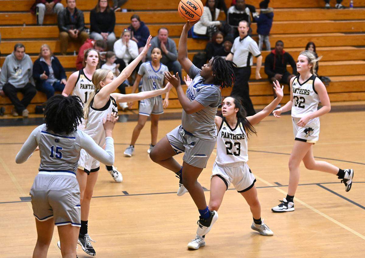 Garinger High freshman guard Misa Harris releases a shot in the lane during second half action against Providence High Tuesday, February 7, 2023 at Providence High School.